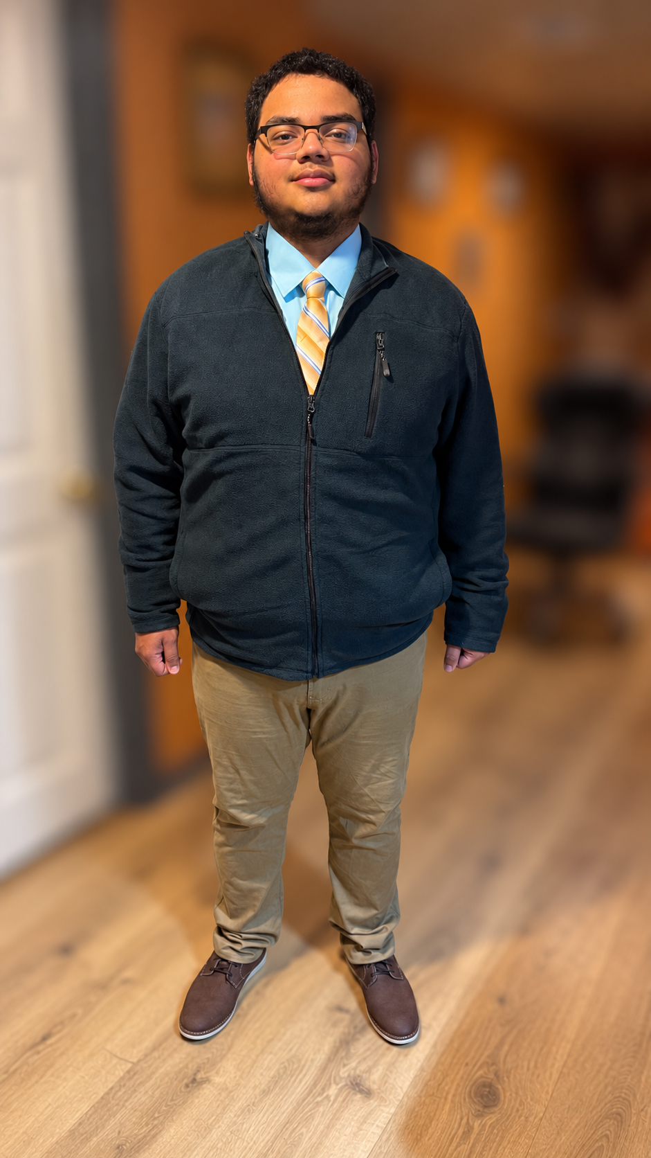 William earlier in his fitness journey, wearing a fleece and tie