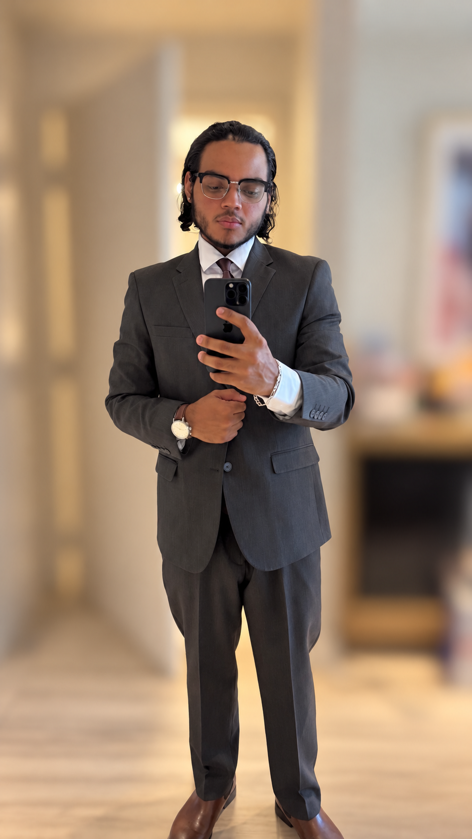 William later in his fitness journey, wearing a suit